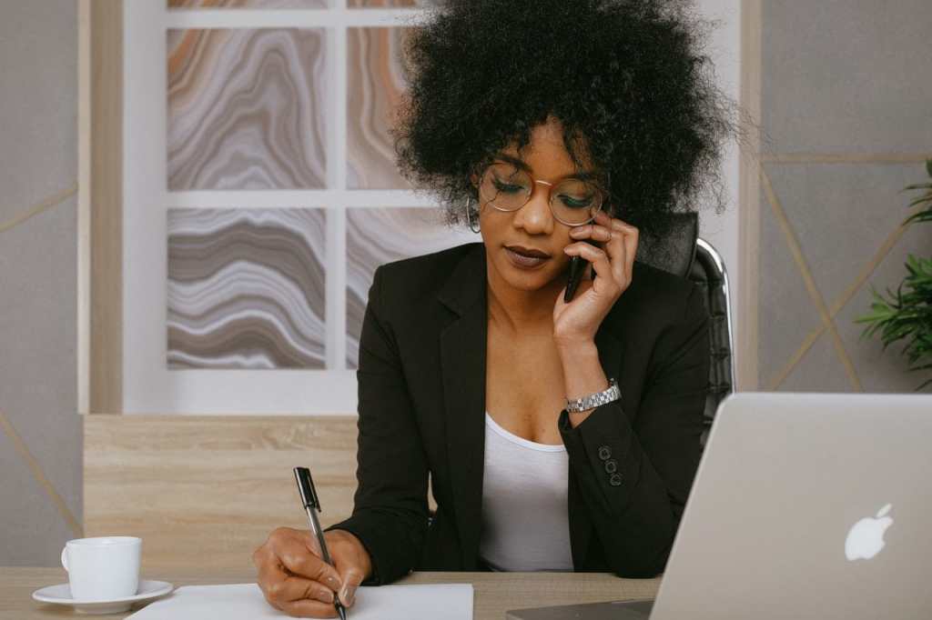 Woman Holding Smartphone - Easy Earned Money: How to Invest in Real Estate 2020